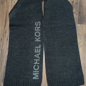 Michael Kors dark gray scarf with metal embellished wording.